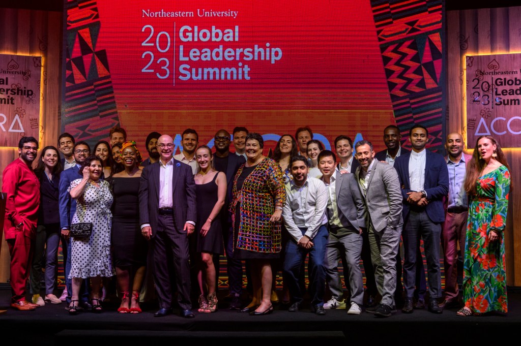 U.S. Ambassador to Ghana Virginia E. Palmer and Northeastern President Joseph E. Aoun and Northeastern young global leaders standing on a stage