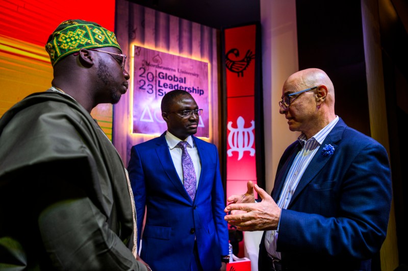 President Aoun speaking with two panelists at the Global Leadership Summit in Ghana