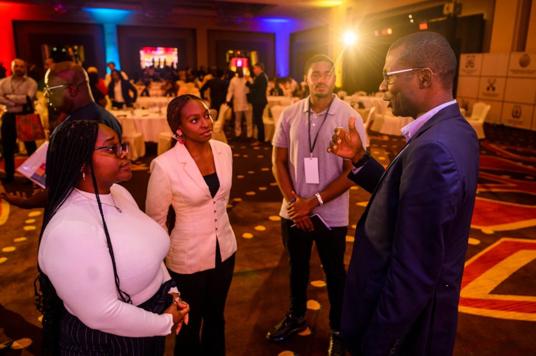 panelist speaking to audience members in Global Leadership Summit in Ghana