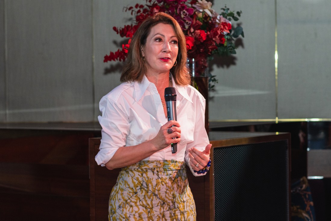 Diane MacGillivray speaking into a microphone