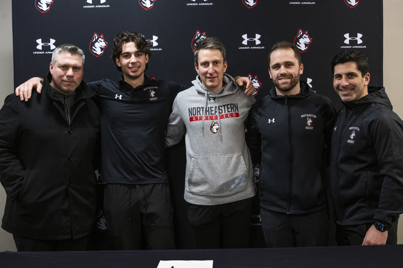 Devon Levi posing with 4 other people