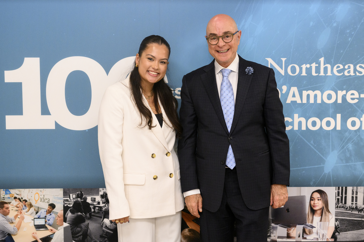 President Joseph E Aoun posing for a photo with another person at D'Amore McKim's 100th Anniversary event