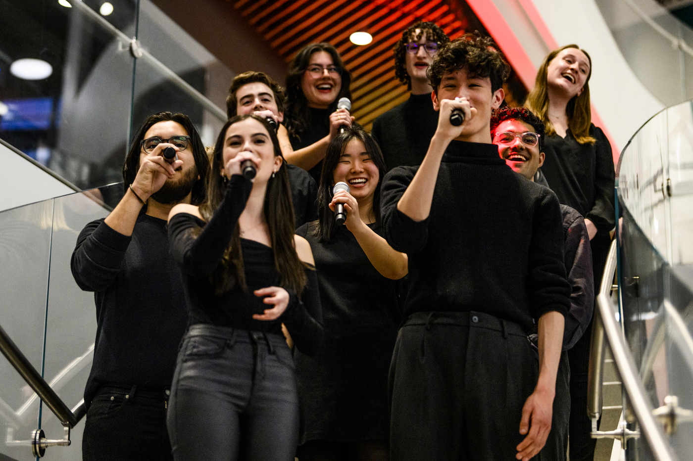 a capella group singing at D'Amore McKim's 100th Anniversary event