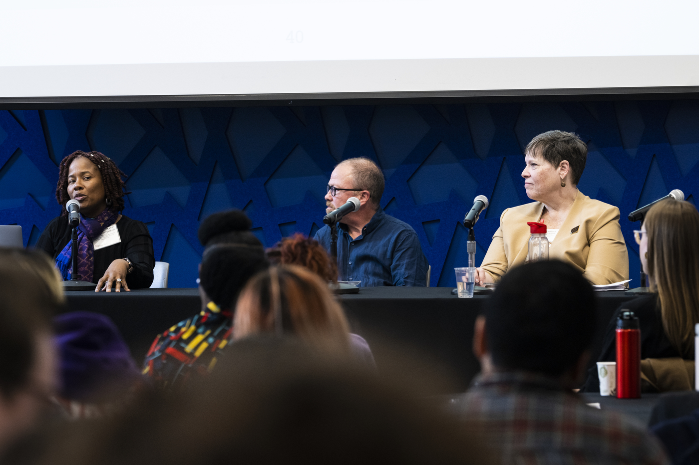 panelists speaking at the Feminists on the Politics of Crisis symposium