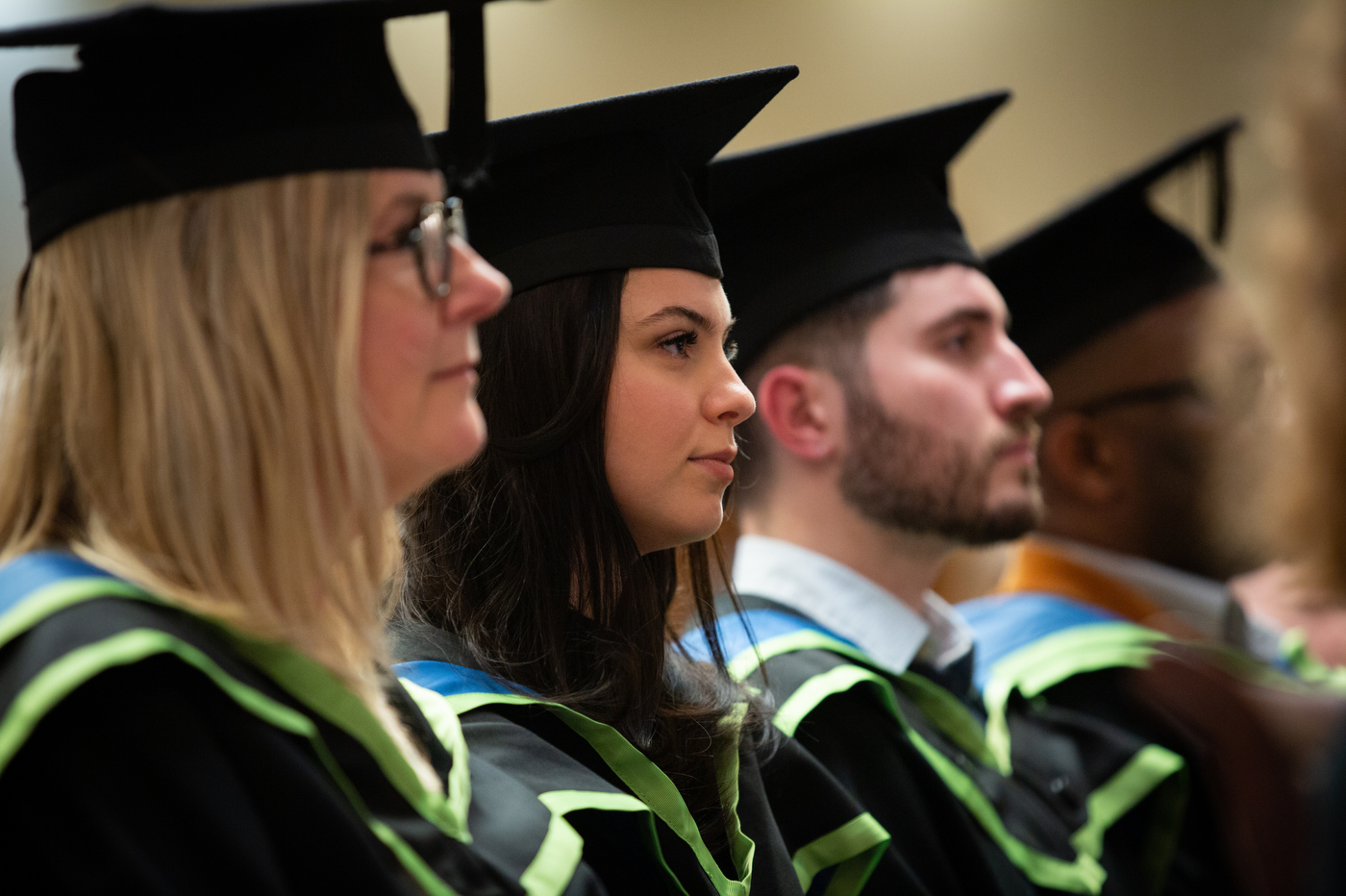 students wearing caps and gowns at northeastern university london graduation