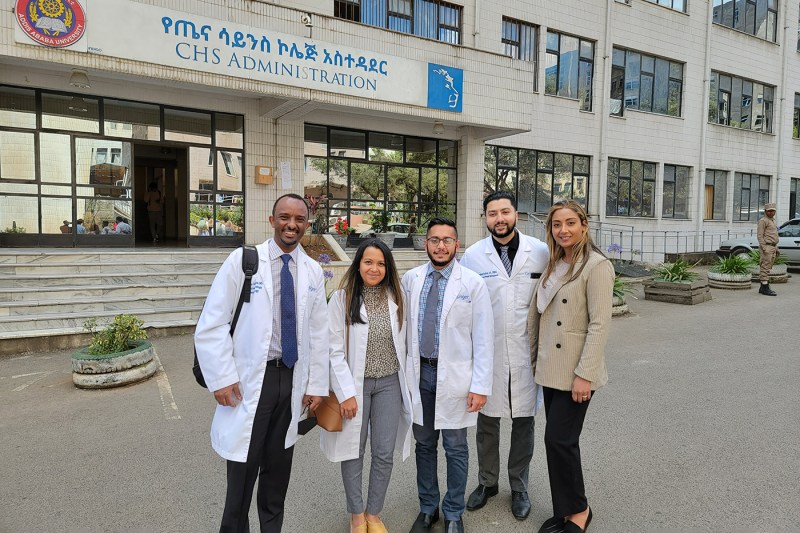 shital waters and four healthcare works posing outside of the hospital