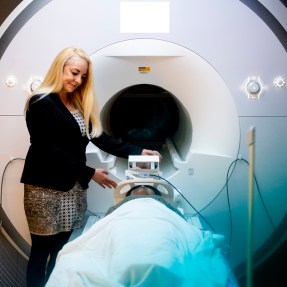 Susan Whitfield-Gabriel in front of a MRI machine