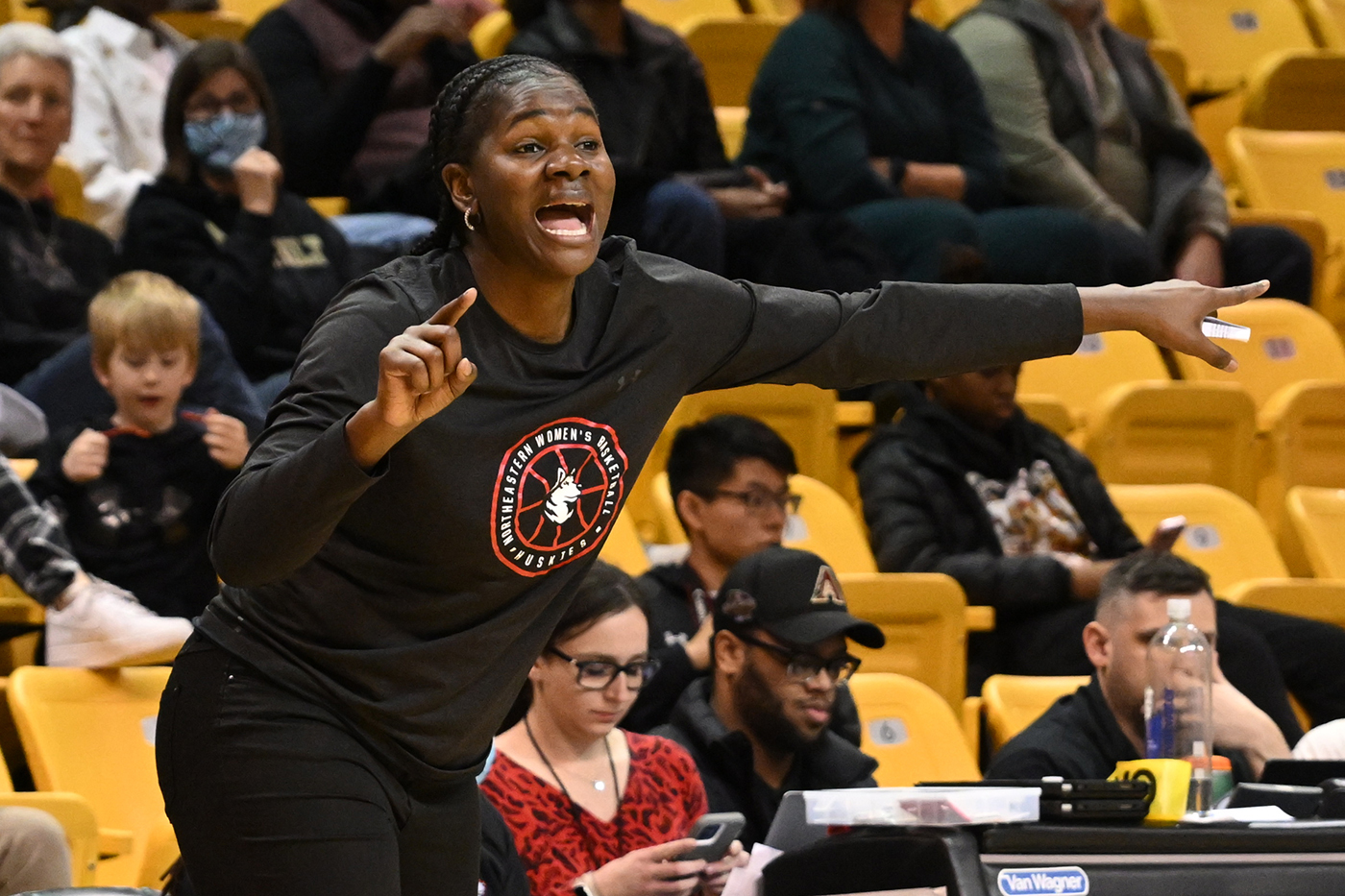 northeastern womens basketball coach yelling from the sideline