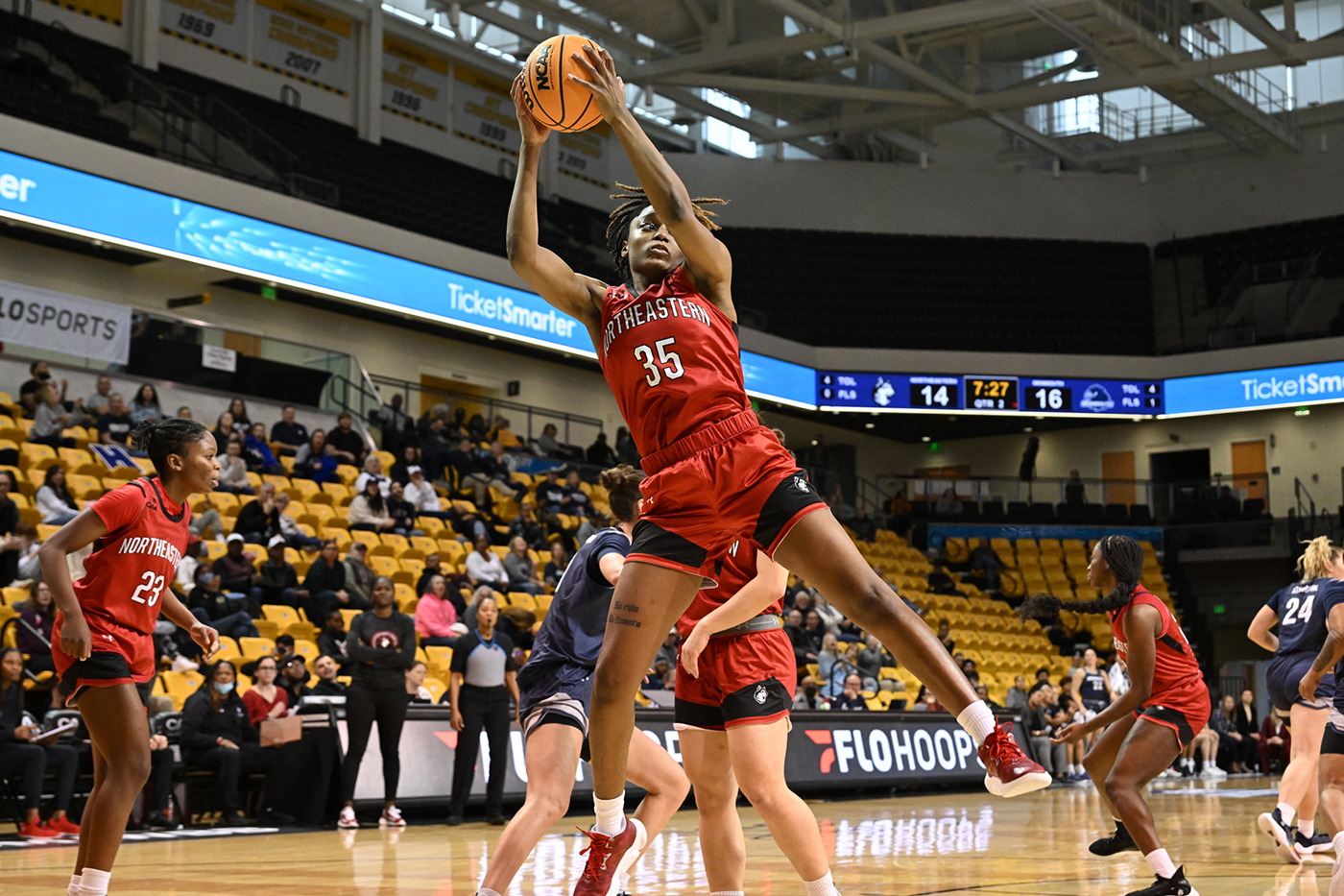 northeastern womens basketball player taking a jumpshot