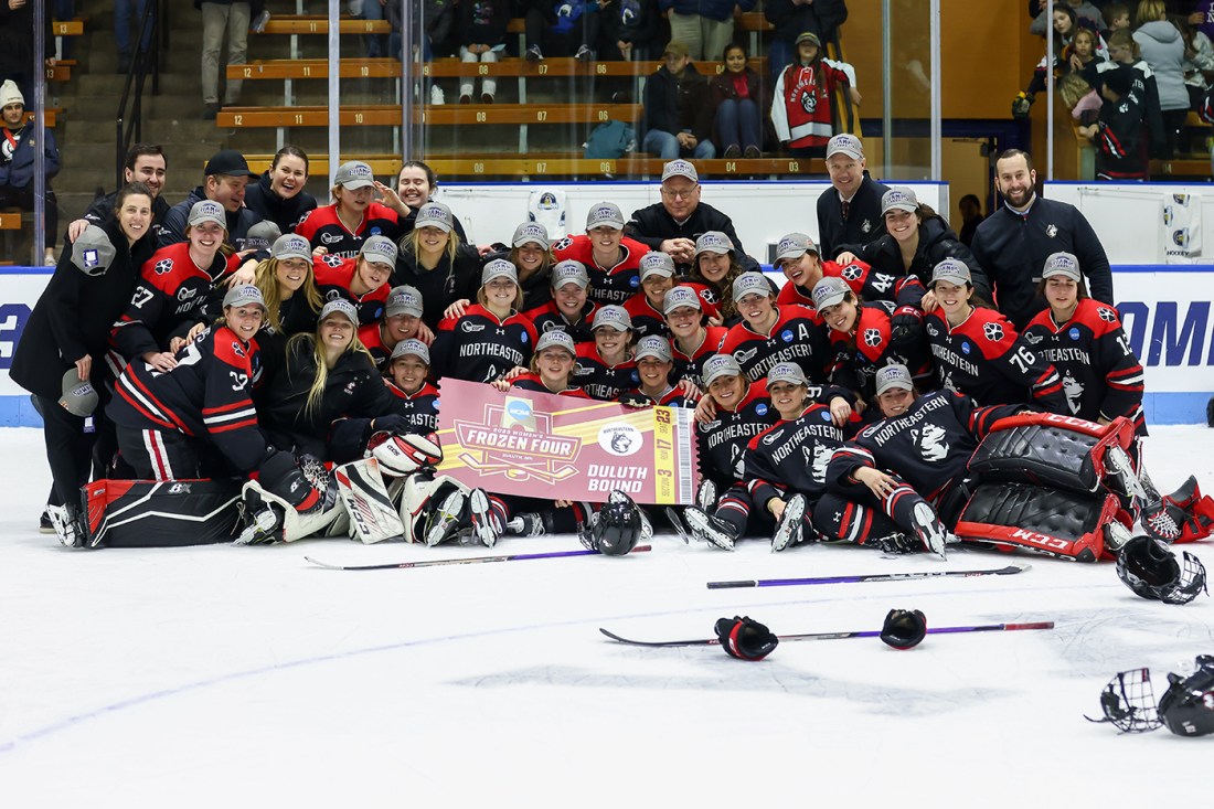 northeastern womens hockey team posing for group photo