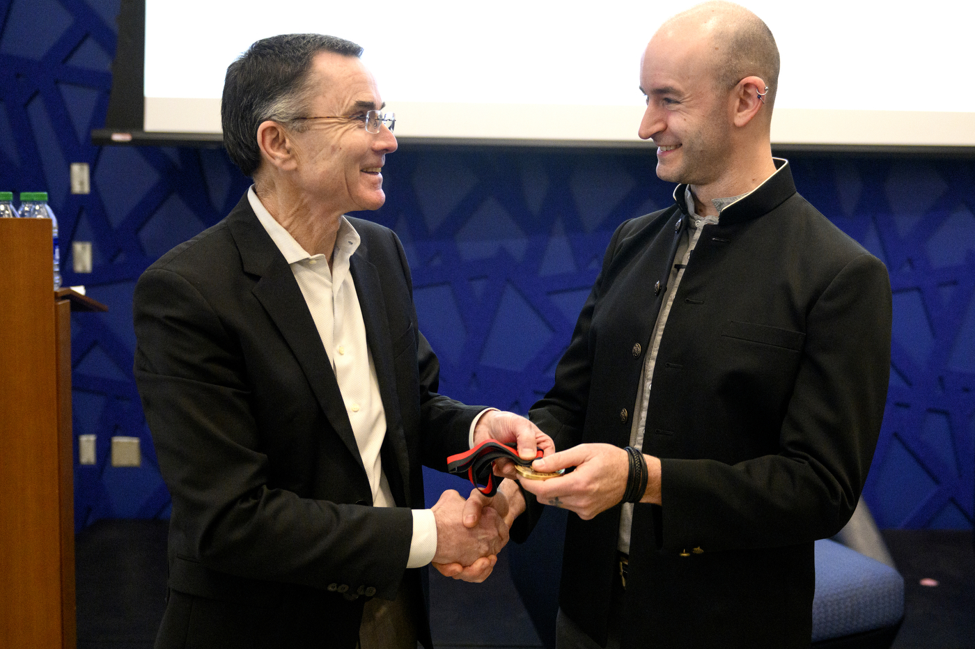 Christon Wilson accepting medal as Robert D. Klein Lecturer