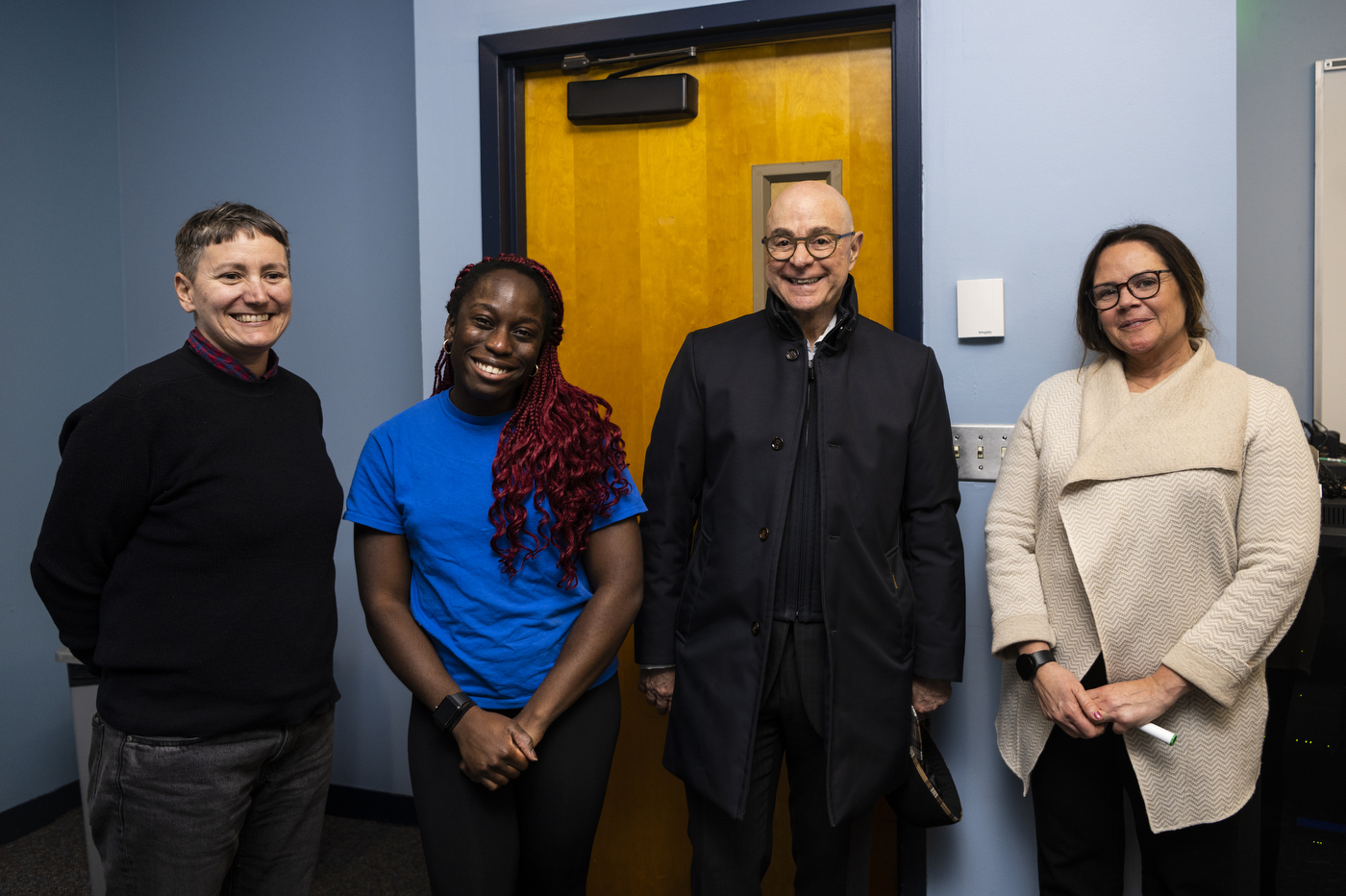 President Joseph E Aoun and Amara Ifeji posing with two other people