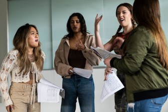 a cappella group members singing