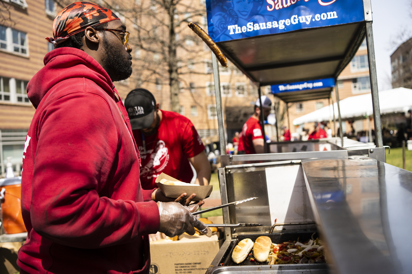 The Sausage Guy workers at a food stand