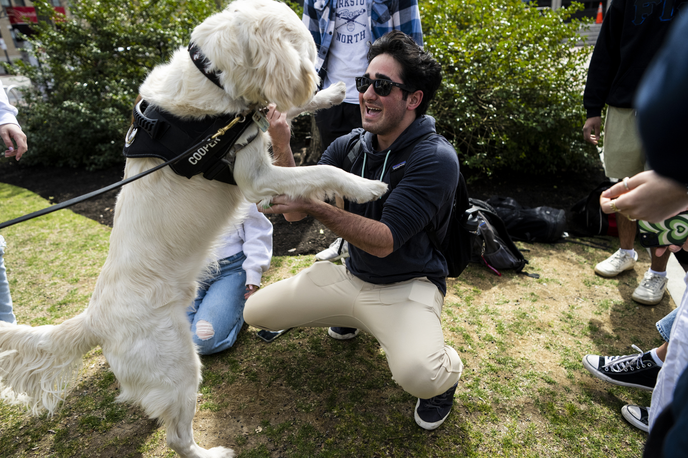 Cooper giving a student a high five