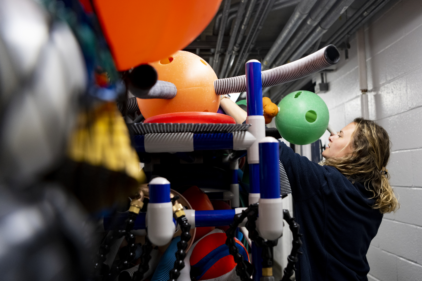 Isabella Welch picking out toys for harbor seals