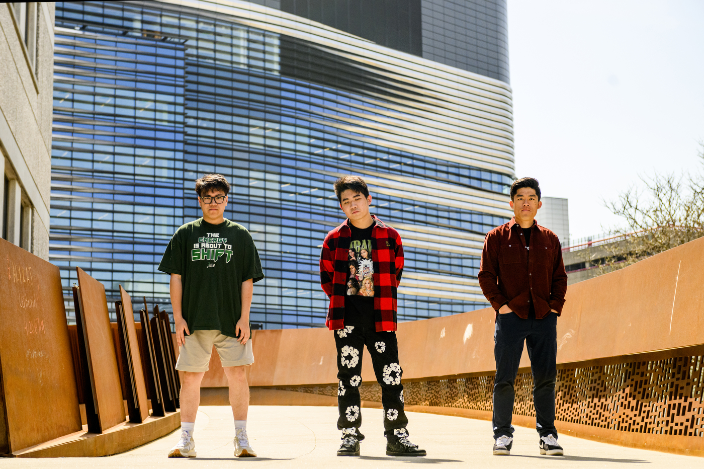 Three members of Huskick's standing on the ISEC bridge.