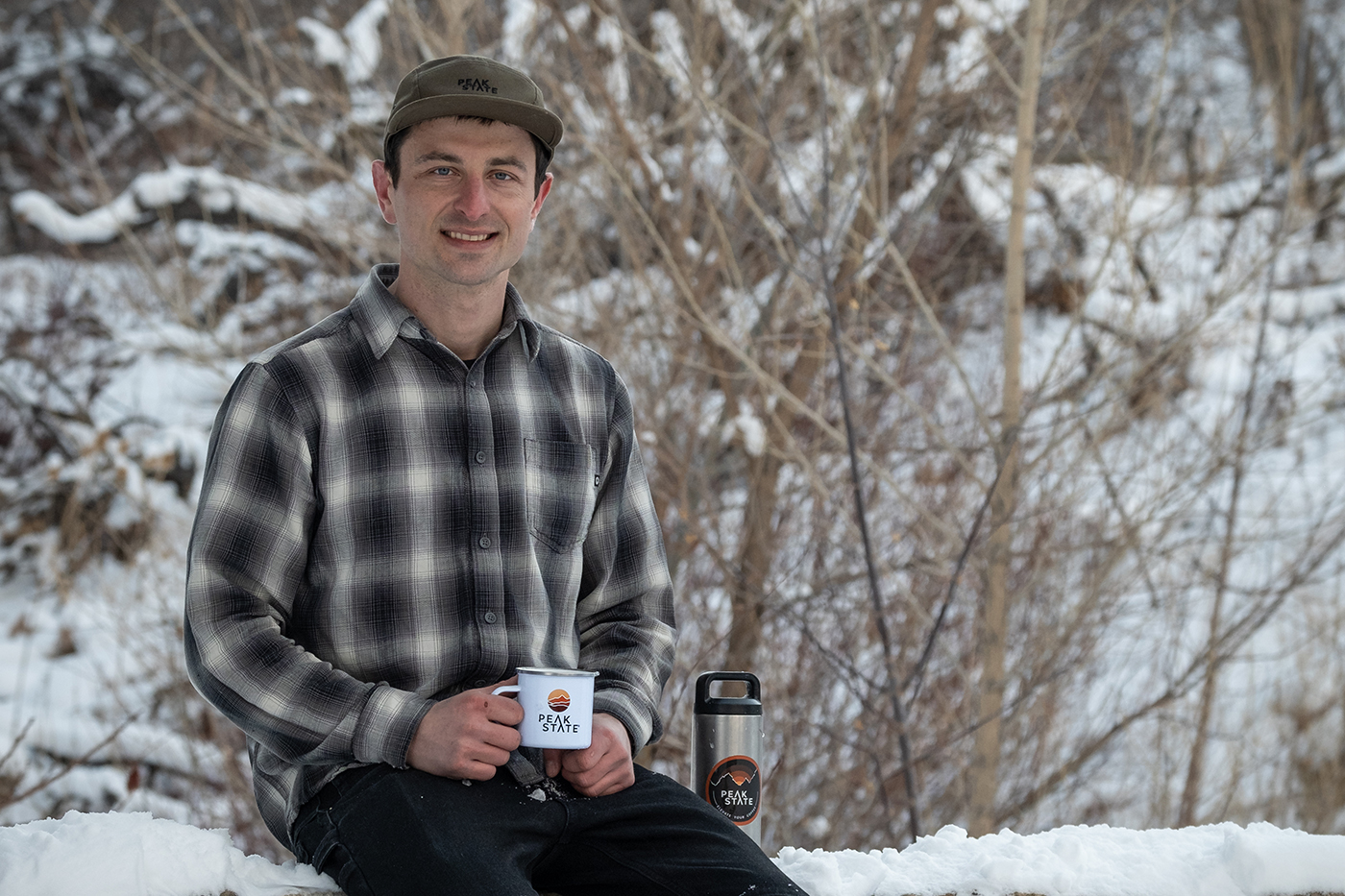 Danny Walsh sits outside with a cup of coffee.