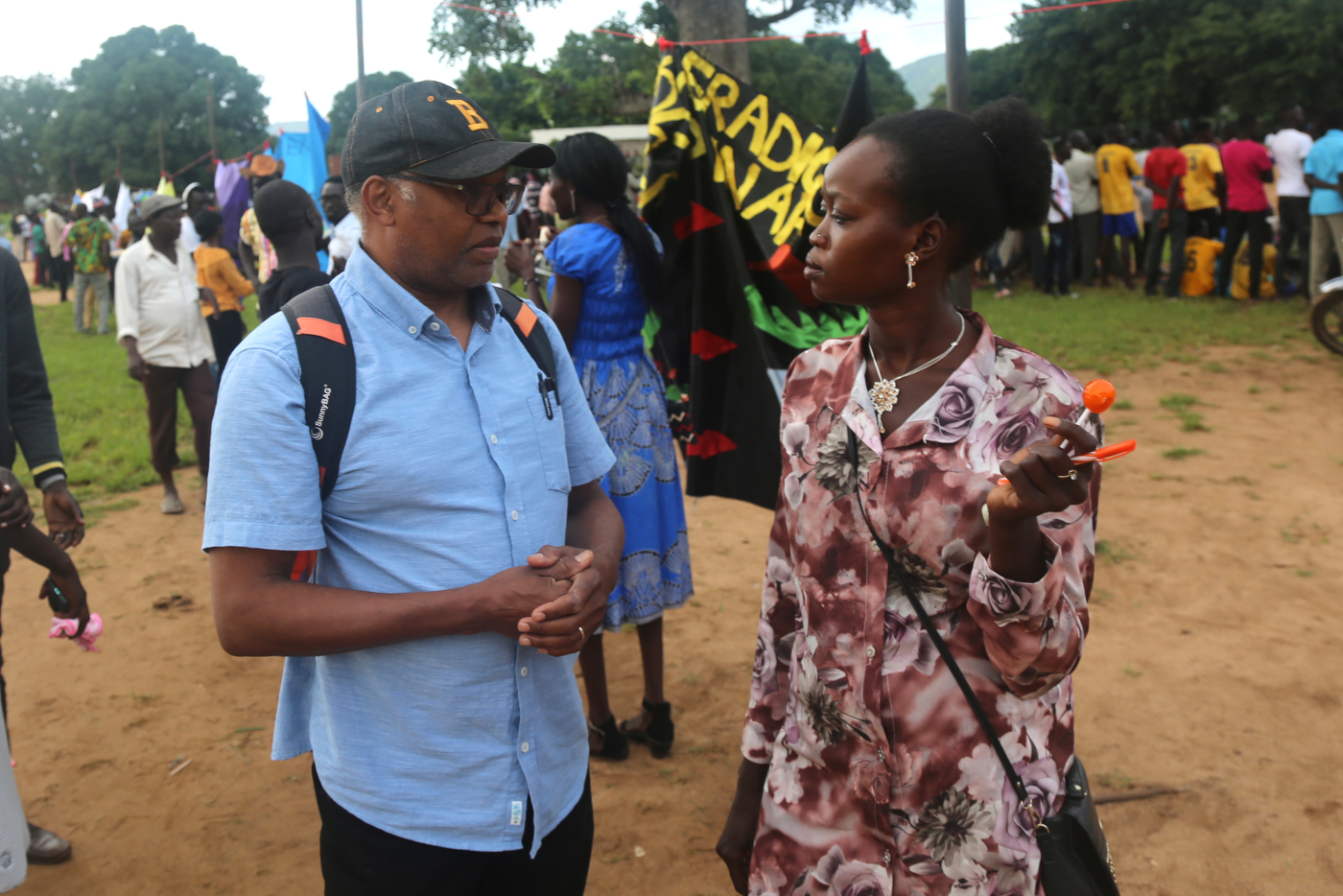 Khalid Kodi speaking to a Sudanese person