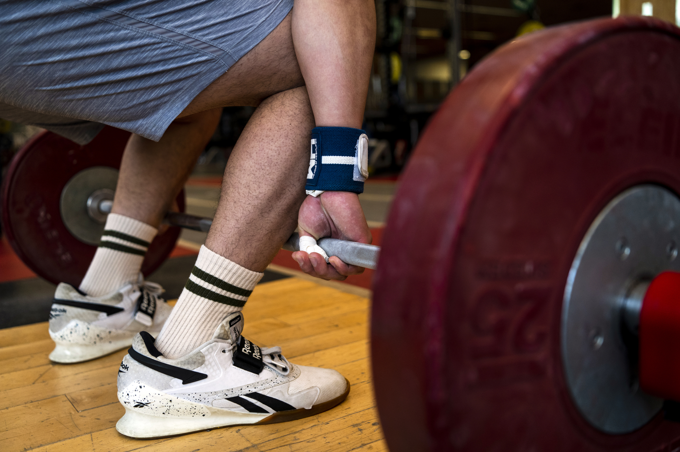 Matt Tung lifting weighted barbell