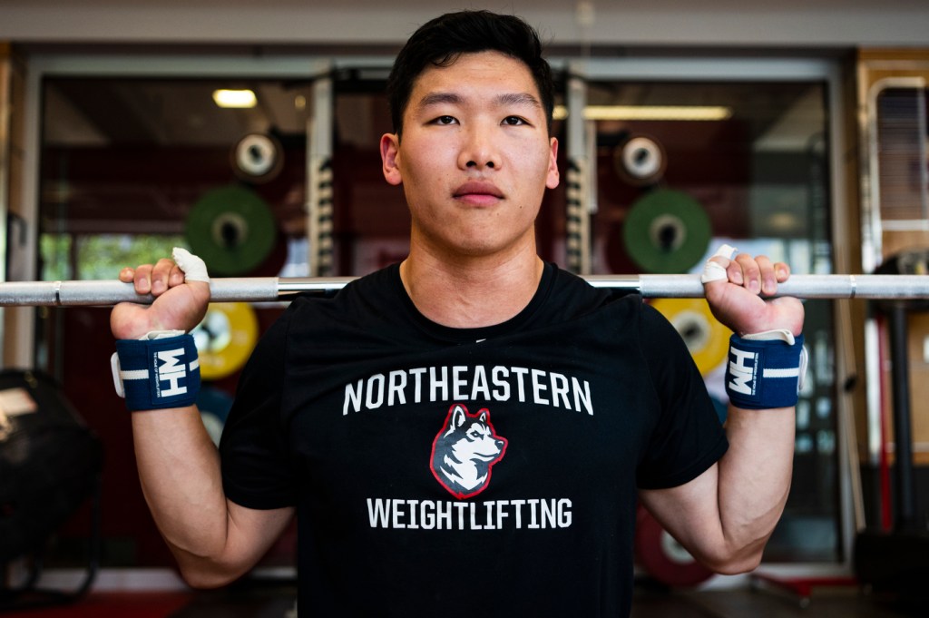 Matt Tung competing in international weightlifting.