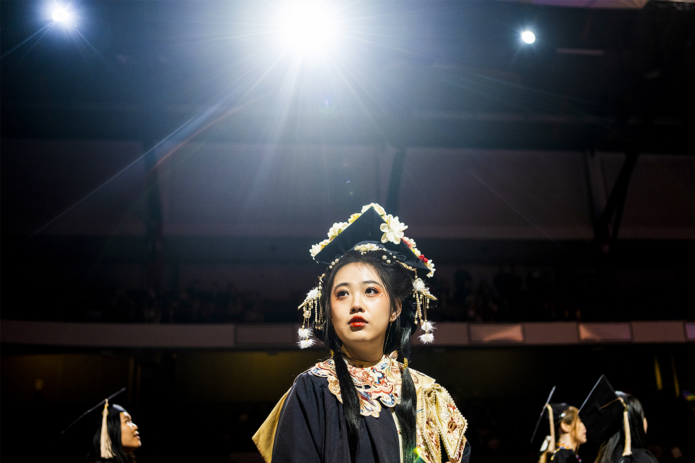 Meng Han wearing a decorated mortarboard