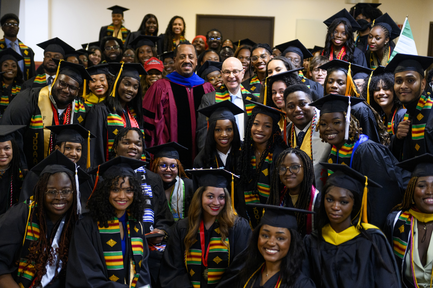 graduates posing with President Joseph E Aoun