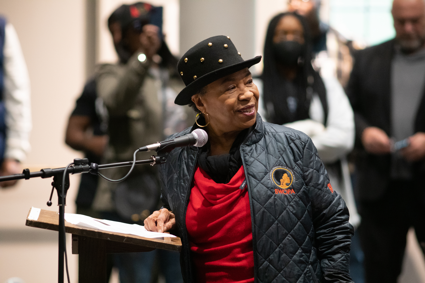 Barbara Lee speaking into a microphone