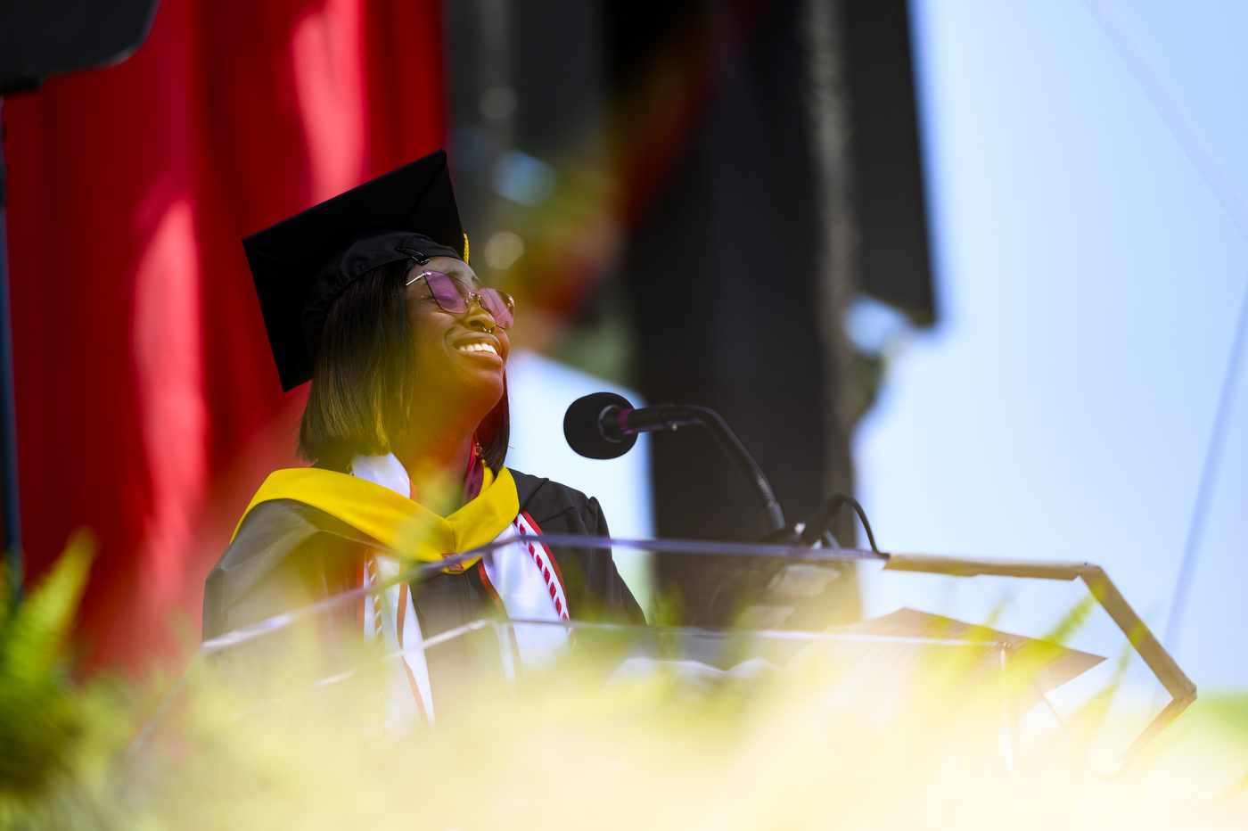 Kristine Umeh at the commencement podium.