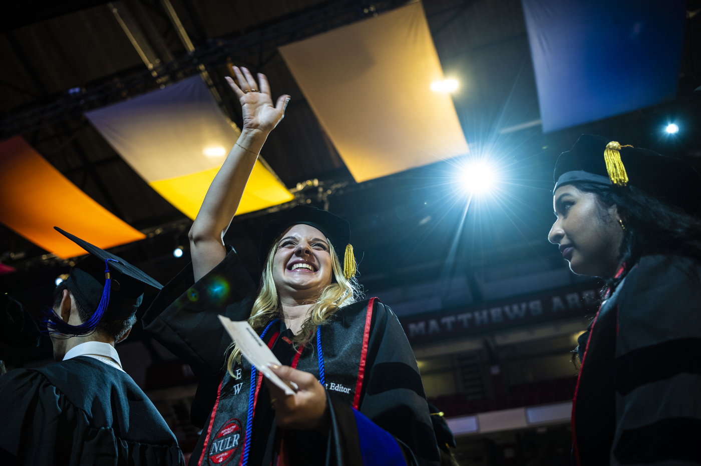 Northeastern School of Law graduates standing in line.