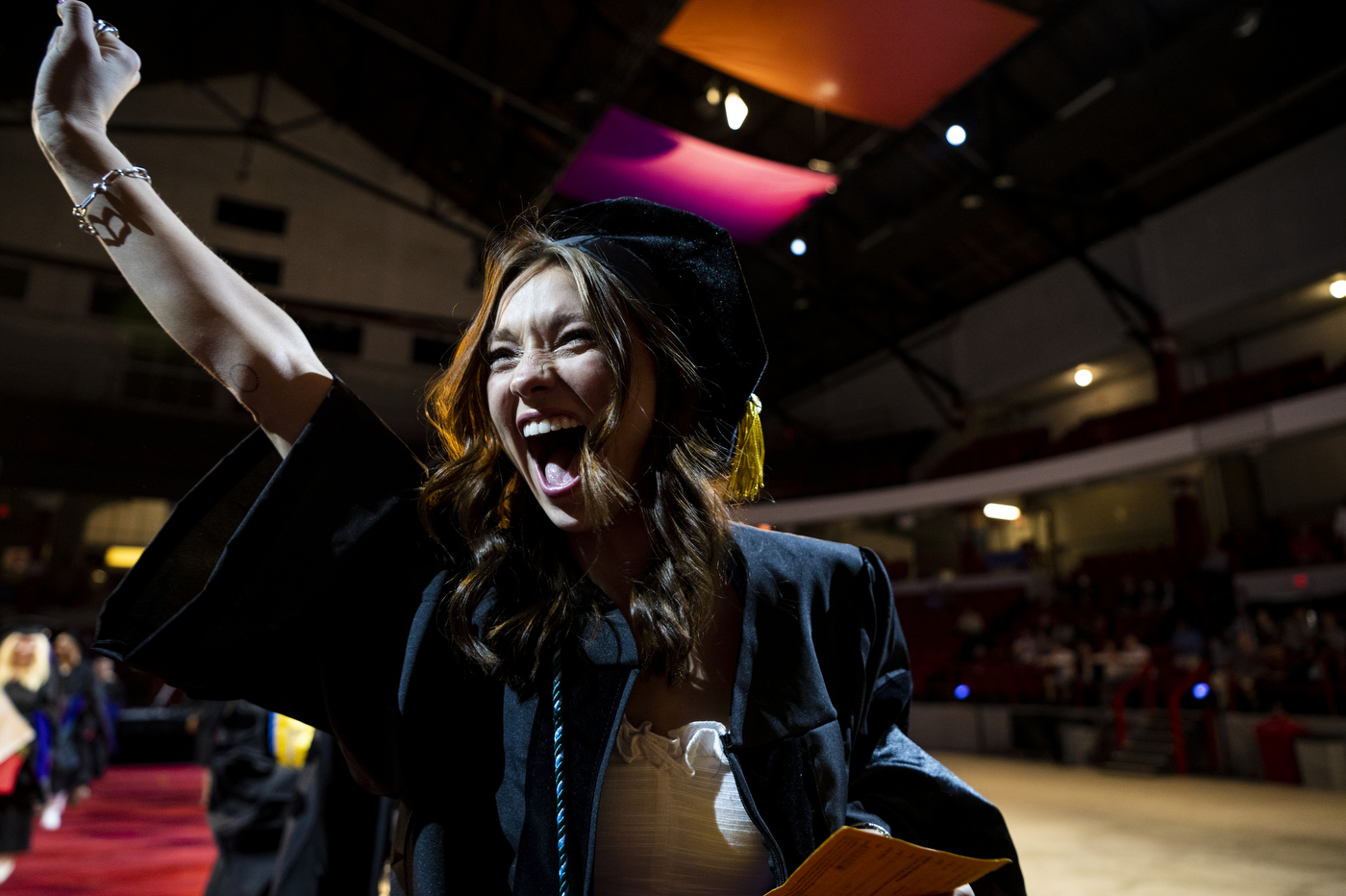 A Northeastern School of Law graduate cheering.