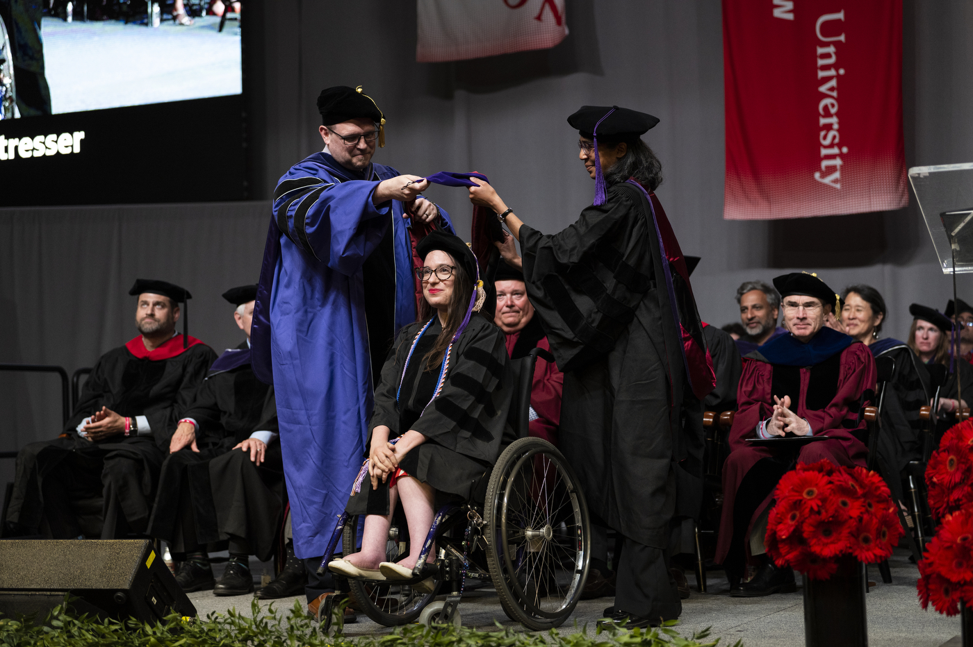 A Northeastern School of Law graduate receives an award.