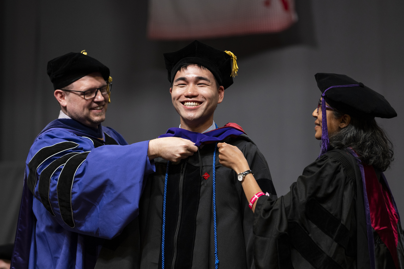 A graduate receives an award.