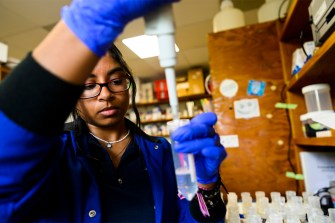 Anushka Rajagopalan working with a lab sample