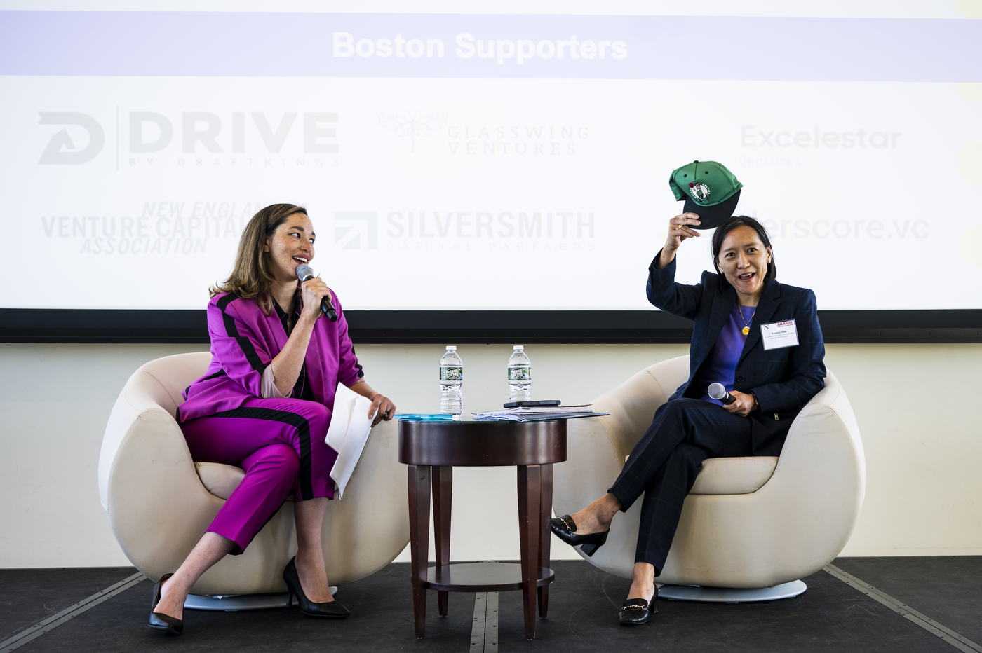 Yvonne Hao holding up Boston Celtics hat