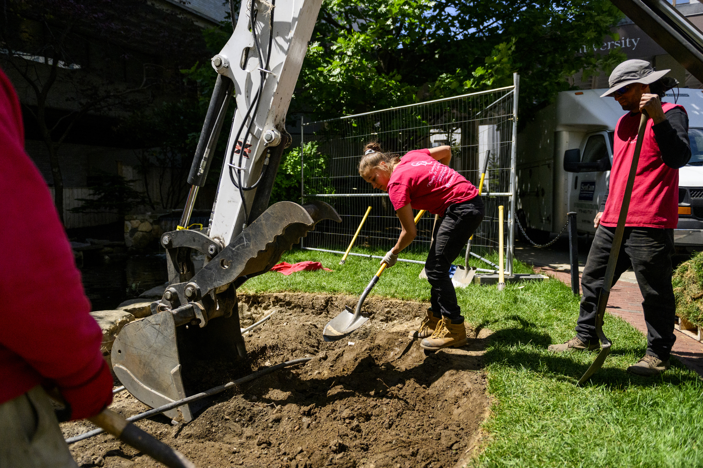 construction workers working on koi pond renovation