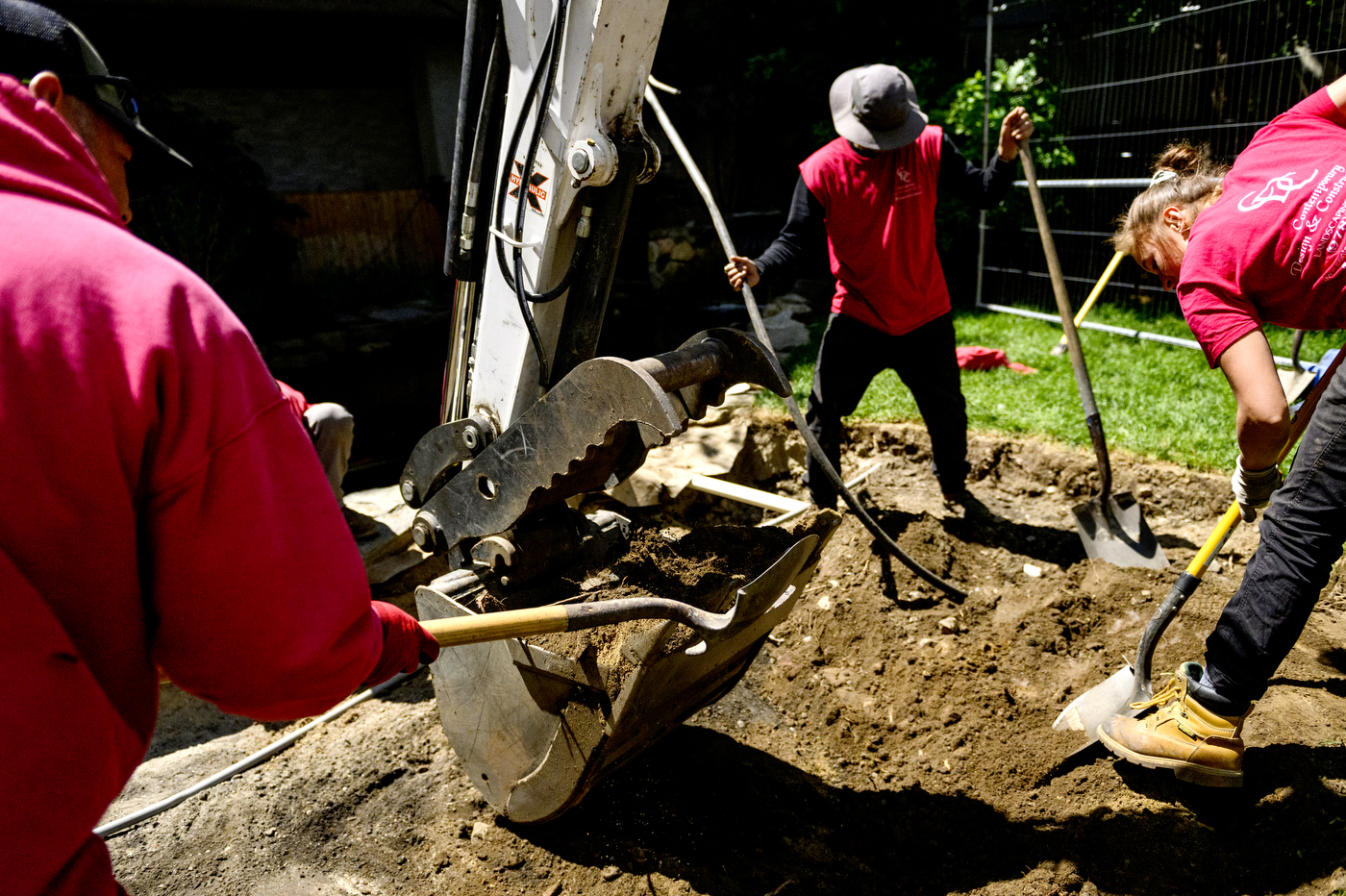 construction workers working on koi pond renovations