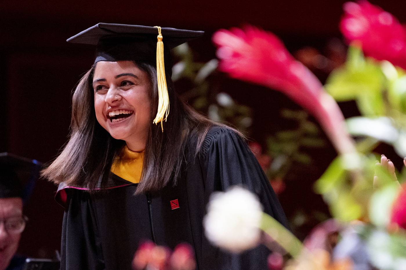 graduate laughing in regalia