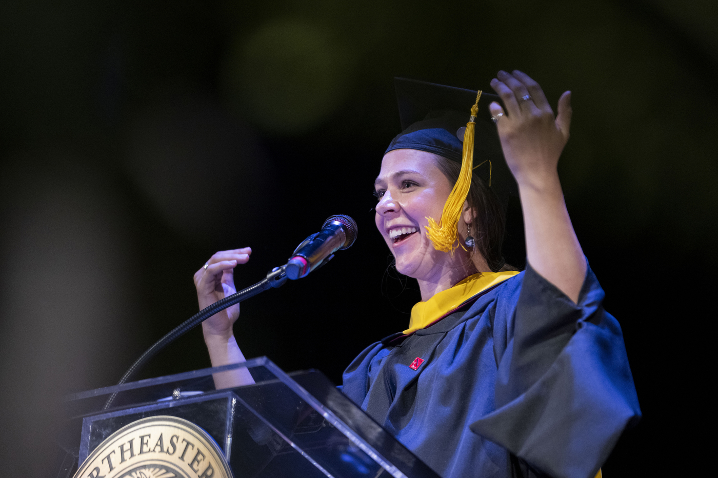 speaker at Vanxouver convocation gesturing with their arms