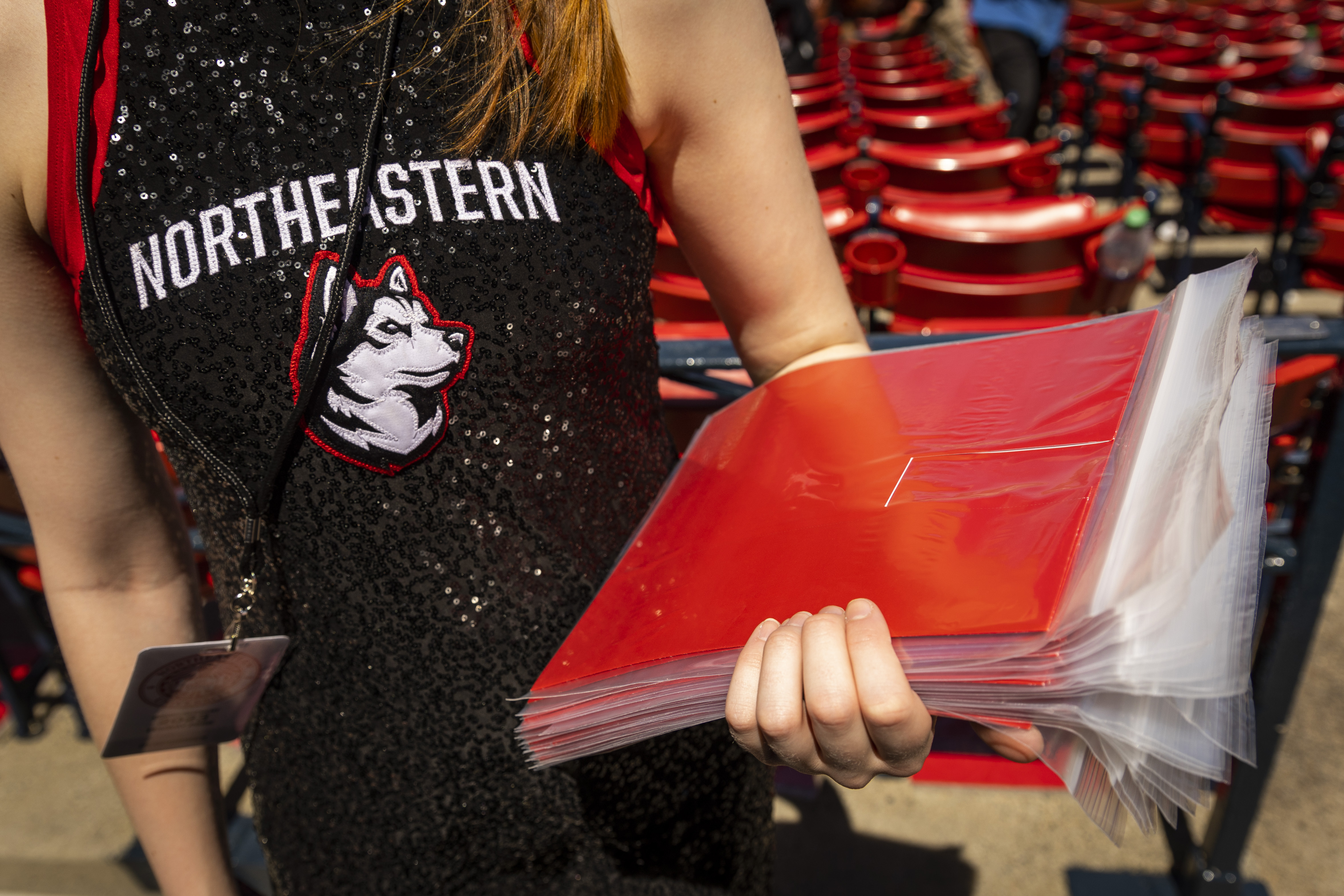 volunteer holding red cards