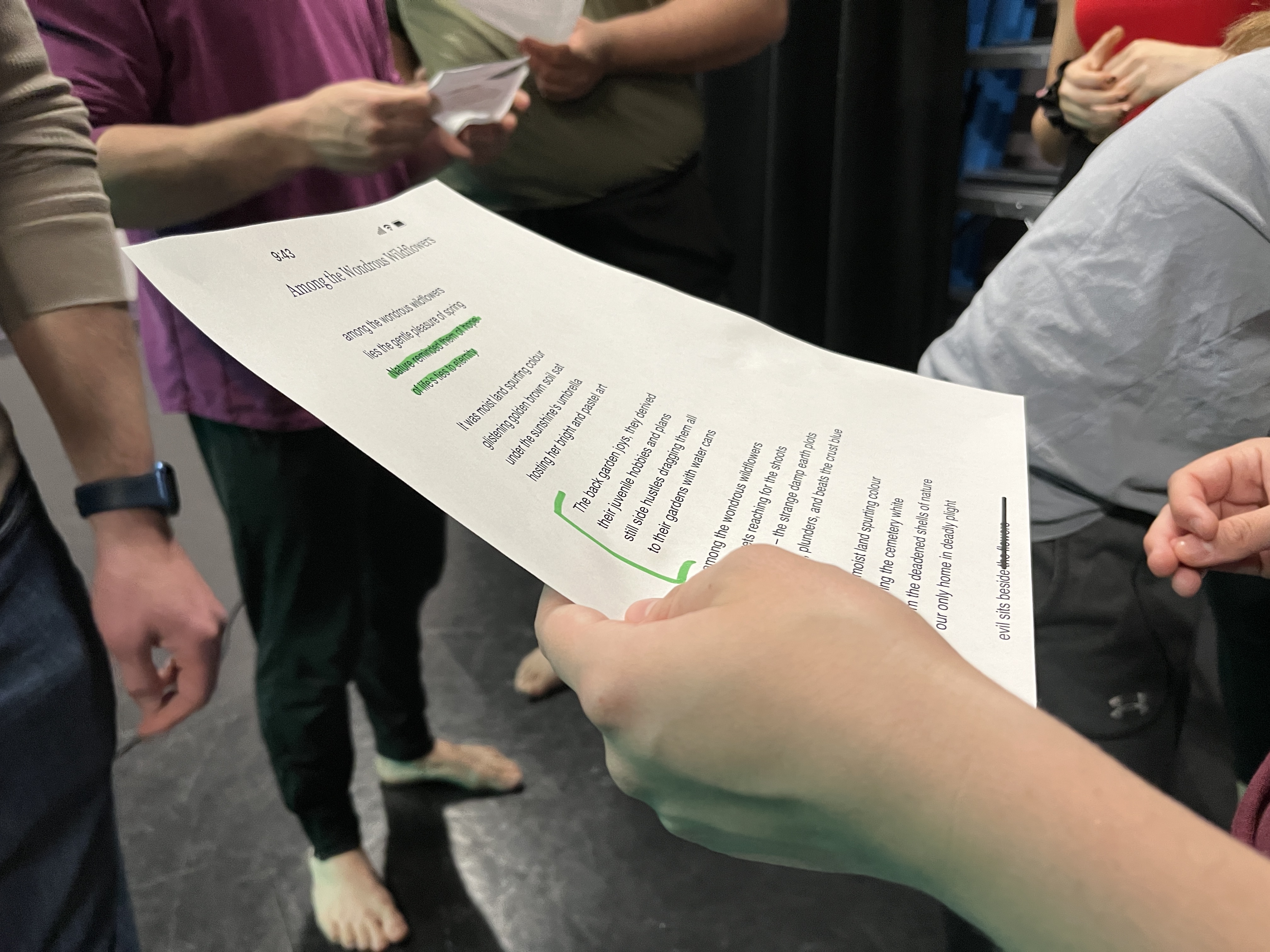 student holding a highlighted script