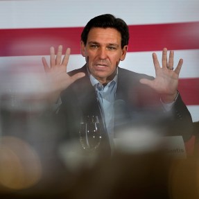 Ron DeSantis speaking at political event in front of a US flag