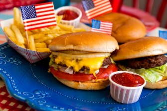 cheese burgers and french flies on a blue platter