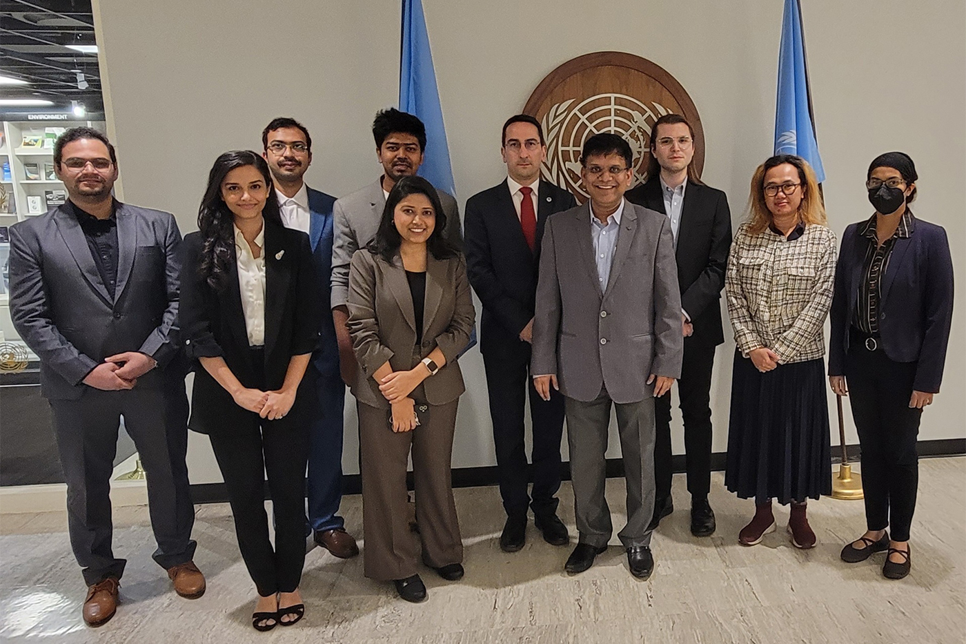 group of people posing at UN meeting