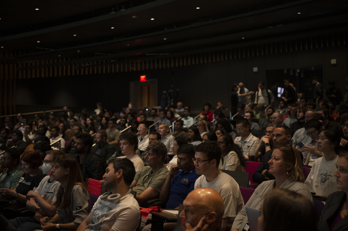 full auditorium for AI fireside chat at Northeastern University's ISEC building