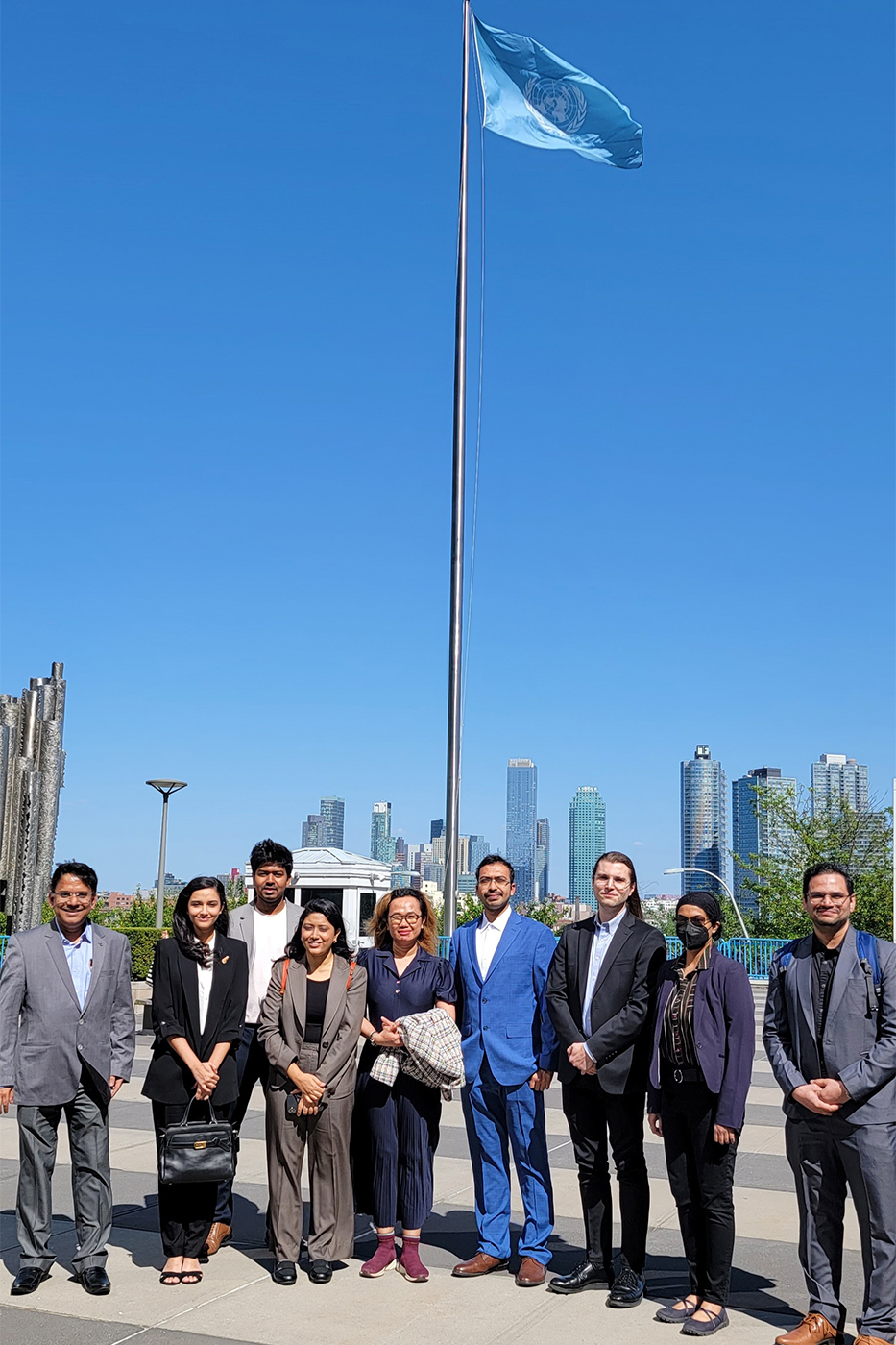 group of people posing at UN meeting