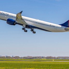 Delta Airlines airplane taking off from a runway