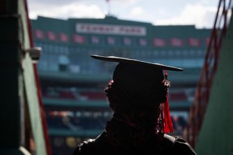 A graduate student walks into Fenway park