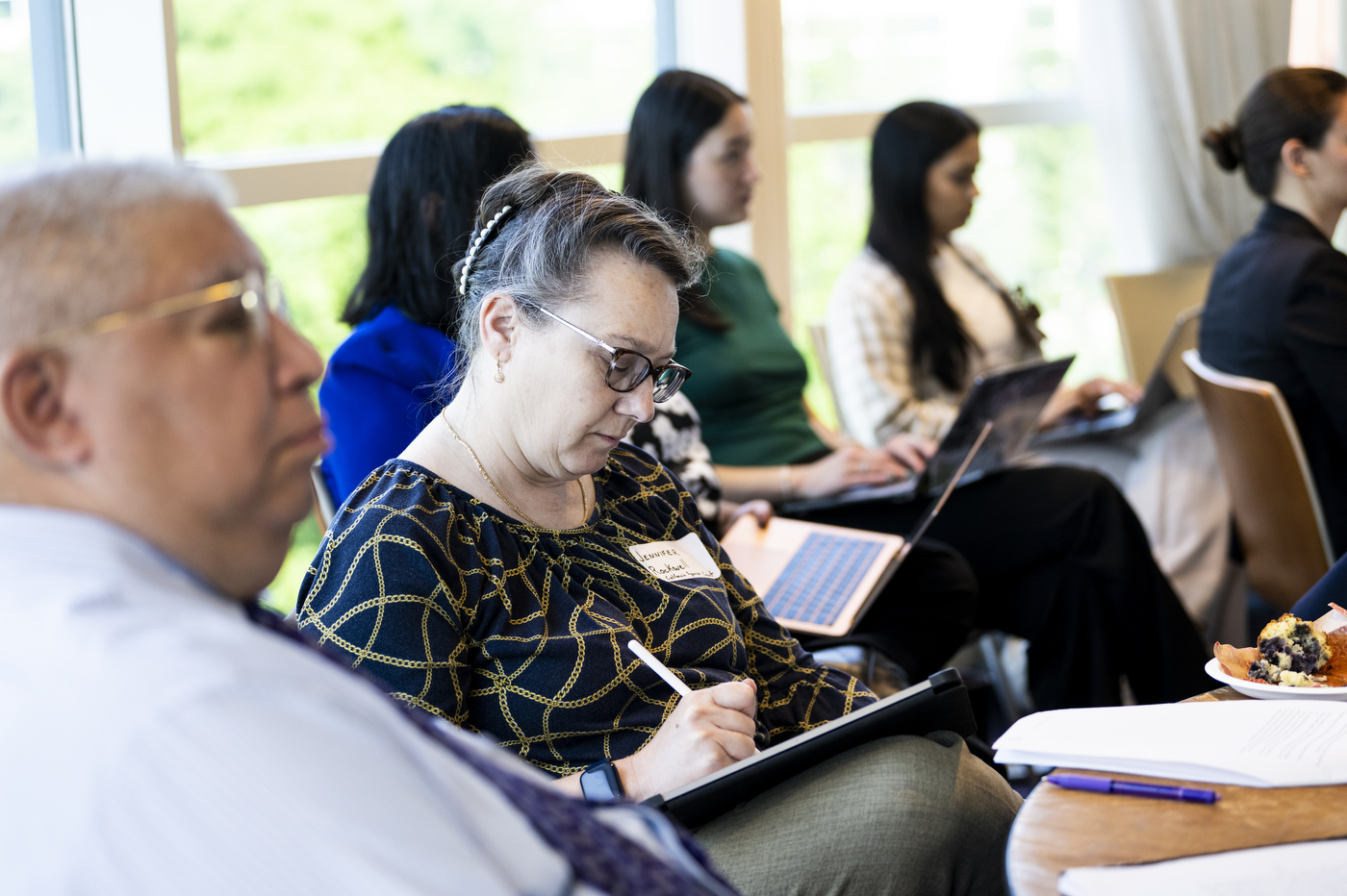 People react during a program on social determinants of health.