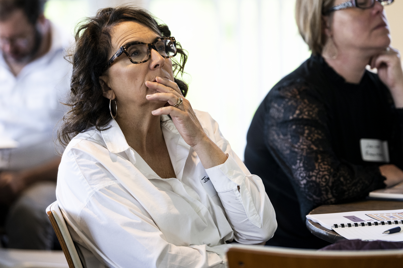 People react during a program on social determinants of health.